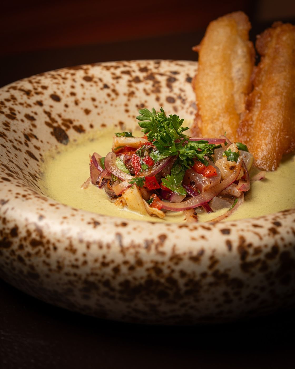 Ceviche in a speckled bowl, a Latin American small plate at La Licor